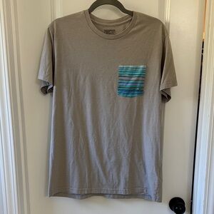 Patagonia Tan T-Shirt with Blue Striped Pocket